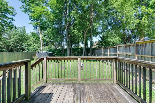 699 New York St, Memphis, TN 38104 - deck featuring a storage unit and a fenced backyard