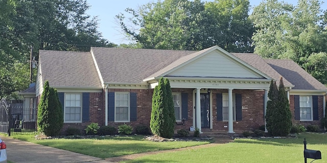 6380 Davidson Cv, Memphis, TN 38119 - view of front of home featuring brick siding, a front lawn, roof with shingles, and covered porch