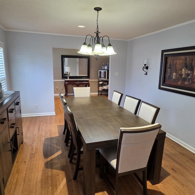 6380 Davidson Cv, Memphis, TN 38119 - dining room featuring wood finished floors and crown molding