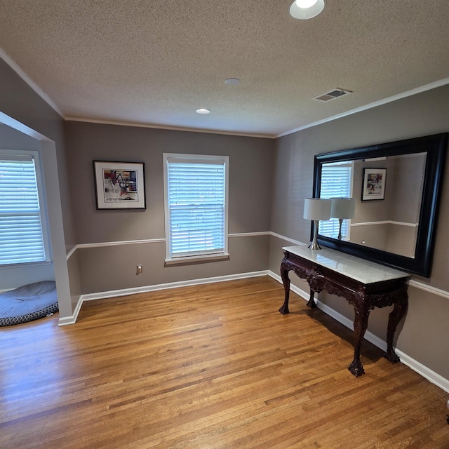 6380 Davidson Cv, Memphis, TN 38119 - home office with a textured ceiling, crown molding, and light wood finished floors
