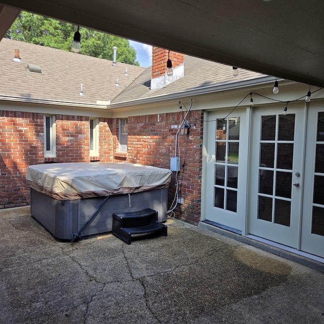 6380 Davidson Cv, Memphis, TN 38119 - view of patio / terrace with a hot tub and french doors