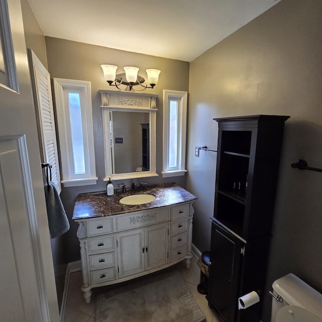 6380 Davidson Cv, Memphis, TN 38119 - bathroom with tile patterned flooring, vanity, and a chandelier