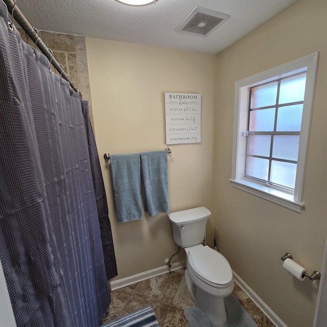 6380 Davidson Cv, Memphis, TN 38119 - full bath featuring curtained shower and a textured ceiling