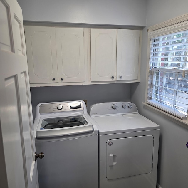 6380 Davidson Cv, Memphis, TN 38119 - laundry area with washer and dryer and cabinet space