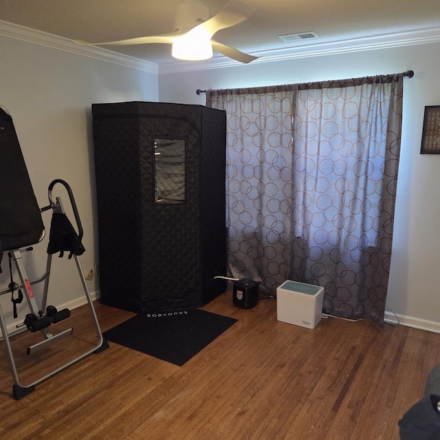 6380 Davidson Cv, Memphis, TN 38119 - exercise area featuring wood finished floors, a ceiling fan, and crown molding