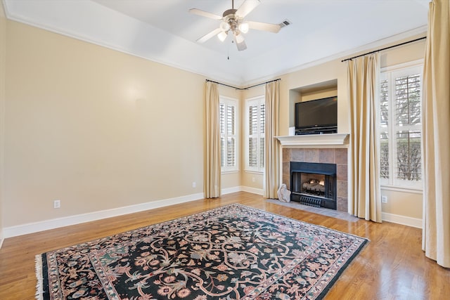 536 Warwick Willow Ln, Collierville, TN 38017 - living area with ceiling fan, wood finished floors, and a tile fireplace