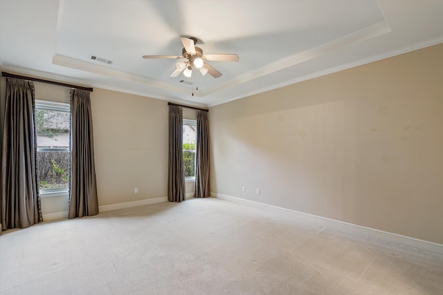 536 Warwick Willow Ln, Collierville, TN 38017 - unfurnished room with a tray ceiling, a ceiling fan, crown molding, and light colored carpet
