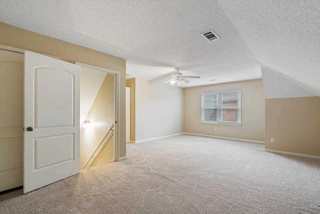 536 Warwick Willow Ln, Collierville, TN 38017 - unfurnished bedroom with light carpet, a textured ceiling, and ceiling fan