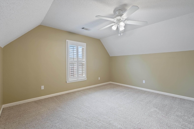 536 Warwick Willow Ln, Collierville, TN 38017 - additional living space featuring vaulted ceiling, carpet floors, a ceiling fan, and a textured ceiling