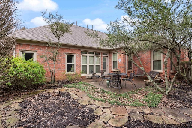 536 Warwick Willow Ln, Collierville, TN 38017 - back of property featuring a patio, brick siding, and a shingled roof