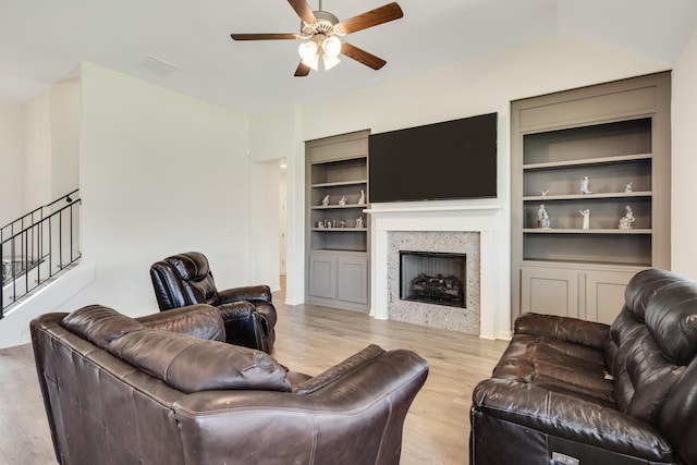 50 Misty Meadow Ln, Oakland, TN 38060 - living room with ceiling fan, light wood-type flooring, built in shelves, a fireplace, and stairs