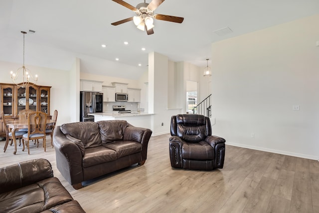 50 Misty Meadow Ln, Oakland, TN 38060 - living room featuring a chandelier, ceiling fan, light wood finished floors, stairway, and recessed lighting