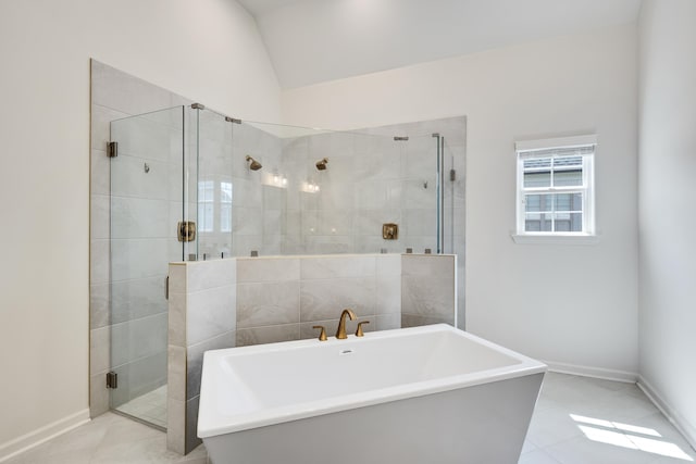 50 Misty Meadow Ln, Oakland, TN 38060 - bathroom featuring tile patterned flooring, a shower stall, a freestanding tub, and vaulted ceiling