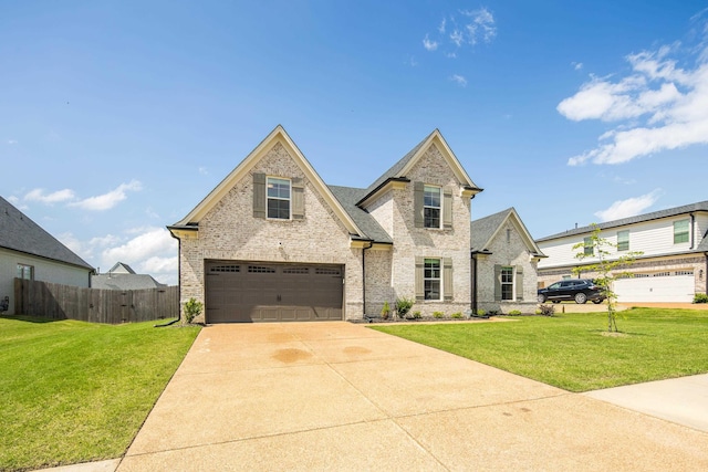 50 Misty Meadow Ln, Oakland, TN 38060 - view of front facade featuring an attached garage, brick siding, and driveway