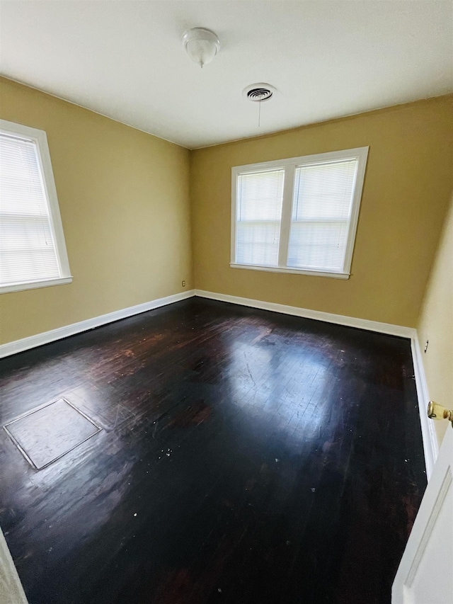 990 N Avalon St, Memphis, TN 38107 - spare room featuring plenty of natural light and wood finished floors