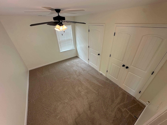 4689 Riva Ridge Dr, Olive Branch, MS 38654 - unfurnished bedroom with carpet flooring, a ceiling fan, and multiple closets