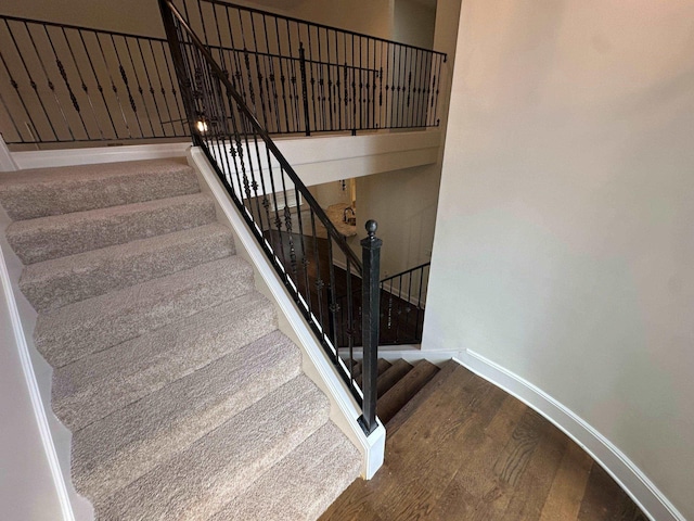 4689 Riva Ridge Dr, Olive Branch, MS 38654 - stairs with wood finished floors and baseboards