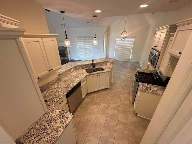 4689 Riva Ridge Dr, Olive Branch, MS 38654 - kitchen featuring stainless steel appliances, recessed lighting, light stone counters, decorative light fixtures, and white cabinets