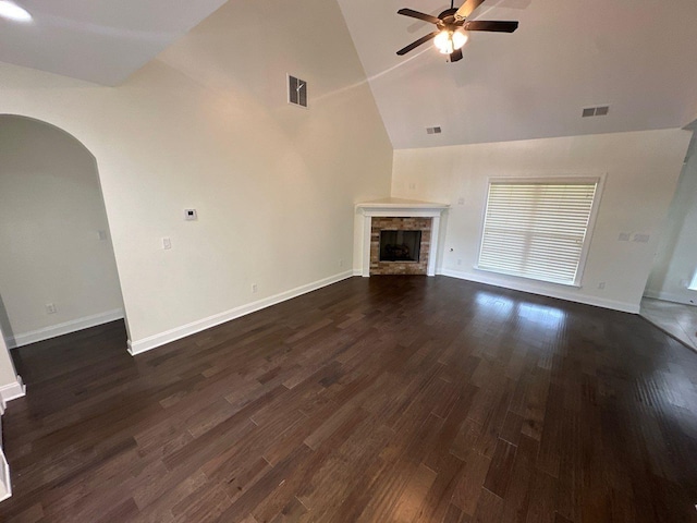 4689 Riva Ridge Dr, Olive Branch, MS 38654 - unfurnished living room featuring ceiling fan, arched walkways, a fireplace, high vaulted ceiling, and dark wood finished floors