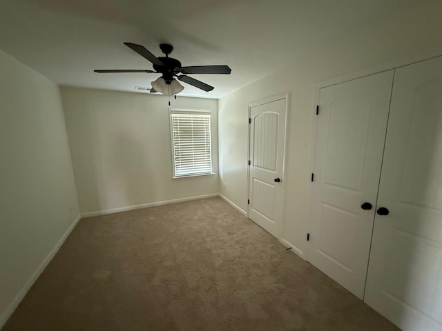 4689 Riva Ridge Dr, Olive Branch, MS 38654 - unfurnished bedroom with carpet floors, two closets, and ceiling fan