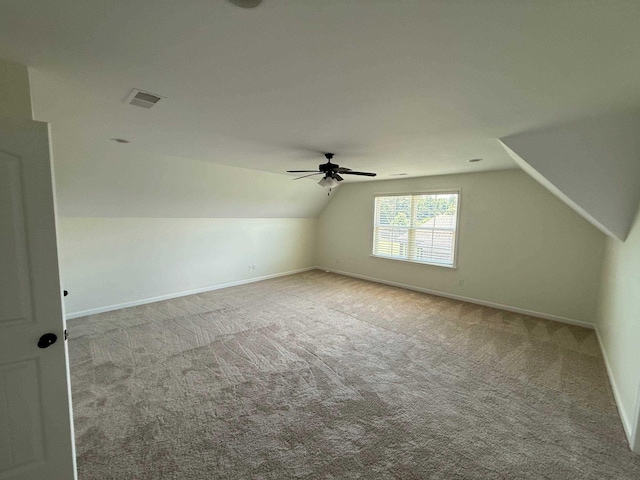 4689 Riva Ridge Dr, Olive Branch, MS 38654 - additional living space with vaulted ceiling, carpet, and a ceiling fan