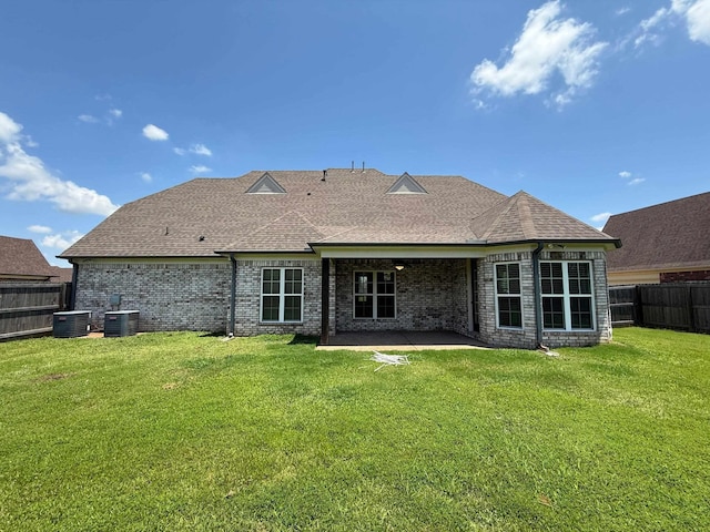 4689 Riva Ridge Dr, Olive Branch, MS 38654 - back of house featuring a fenced backyard, brick siding, a shingled roof, and a patio