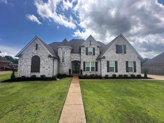 4689 Riva Ridge Dr, Olive Branch, MS 38654 - view of front facade with a front lawn, french doors, and brick siding