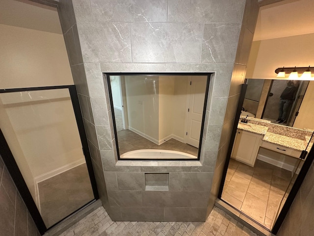 4689 Riva Ridge Dr, Olive Branch, MS 38654 - full bathroom featuring vanity, tile patterned flooring, and tile walls