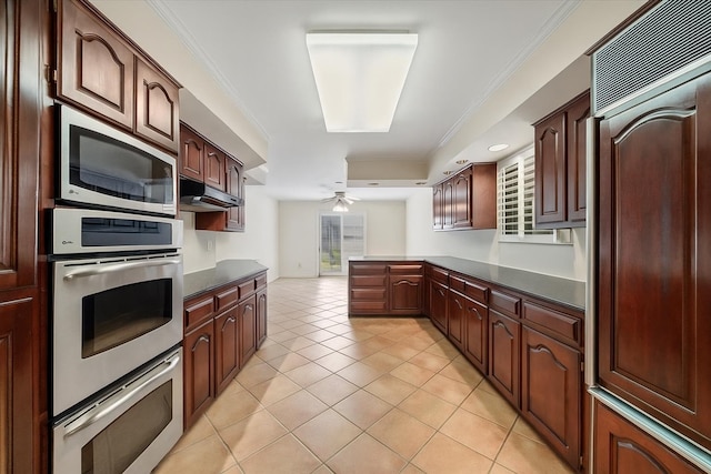 881 S Perkins Rd, Memphis, TN 38117 - kitchen featuring stainless steel appliances, dark countertops, ceiling fan, under cabinet range hood, and a peninsula