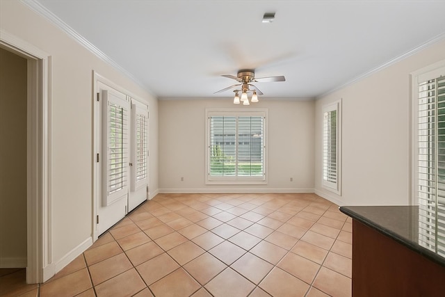 881 S Perkins Rd, Memphis, TN 38117 - unfurnished dining area featuring ceiling fan, light tile patterned floors, and ornamental molding