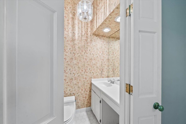 881 S Perkins Rd, Memphis, TN 38117 - half bath featuring wallpapered walls, vanity, and tile patterned floors