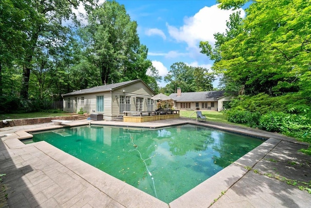 881 S Perkins Rd, Memphis, TN 38117 - swimming pool with a deck, an outbuilding, and a diving board