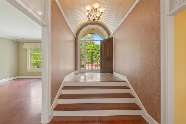 881 S Perkins Rd, Memphis, TN 38117 - stairway with a chandelier, vaulted ceiling, crown molding, and wood finished floors