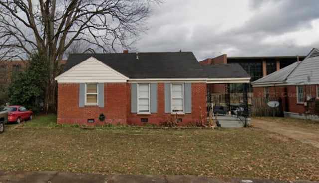 4100 Vaughn Ave, Memphis, TN 38122 - bungalow featuring crawl space, brick siding, and a front yard