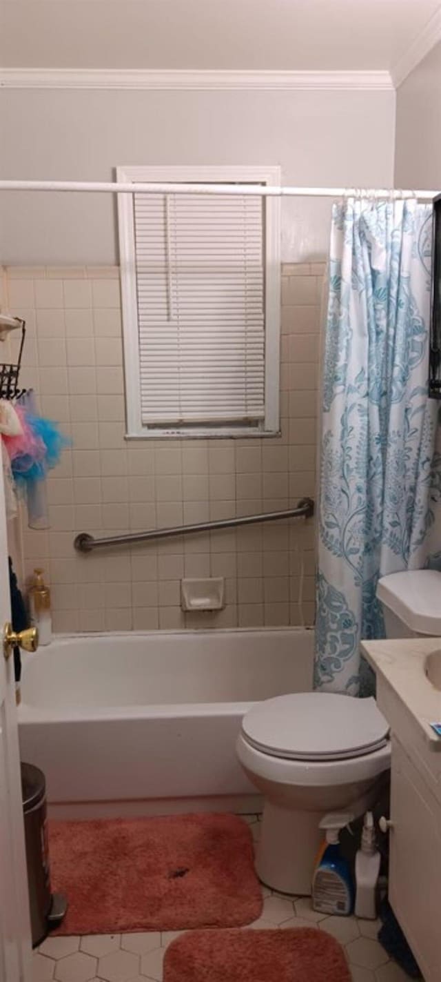 4100 Vaughn Ave, Memphis, TN 38122 - bathroom with tile patterned floors, vanity, shower / bathtub combination with curtain, and ornamental molding
