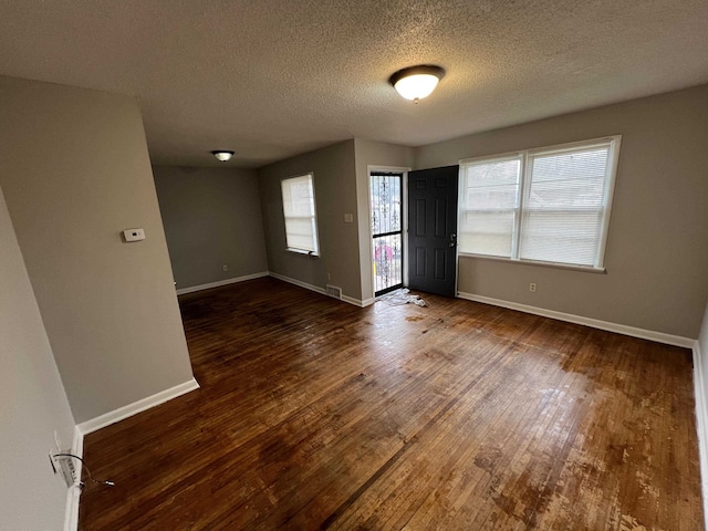 4267 Leroy Ave, Memphis, TN 38108 - empty room with wood finished floors and a textured ceiling
