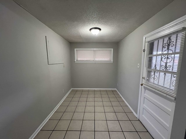 4267 Leroy Ave, Memphis, TN 38108 - empty room featuring a textured ceiling and light tile patterned flooring