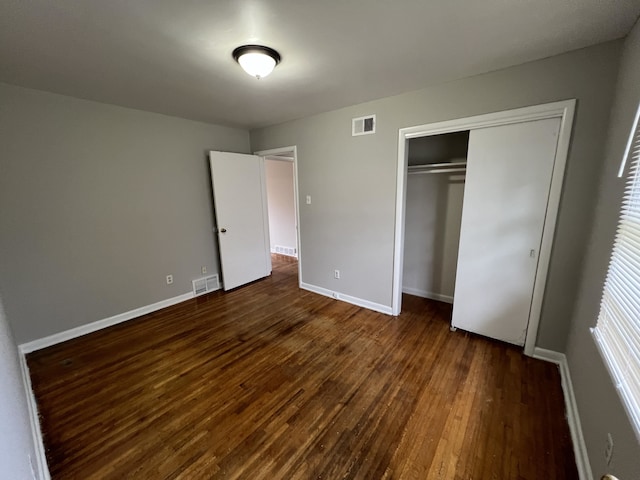 4267 Leroy Ave, Memphis, TN 38108 - unfurnished bedroom featuring dark wood finished floors and a closet