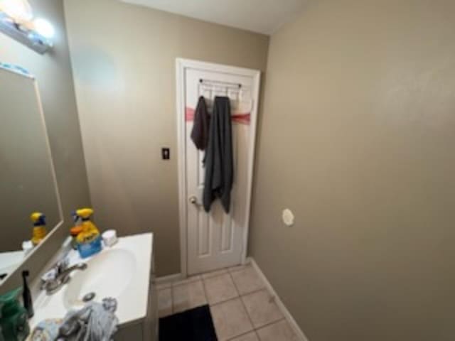 1235 Darlow St, Memphis, TN 38122 - bathroom featuring tile patterned flooring and vanity