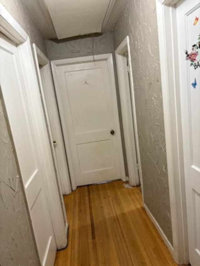 1235 Darlow St, Memphis, TN 38122 - hall with light wood-style flooring and attic access