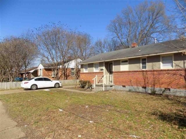 1106 Stratford Rd, Memphis, TN 38122 - view of side of home featuring brick siding and a chimney