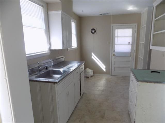 1106 Stratford Rd, Memphis, TN 38122 - kitchen featuring plenty of natural light and white cabinets