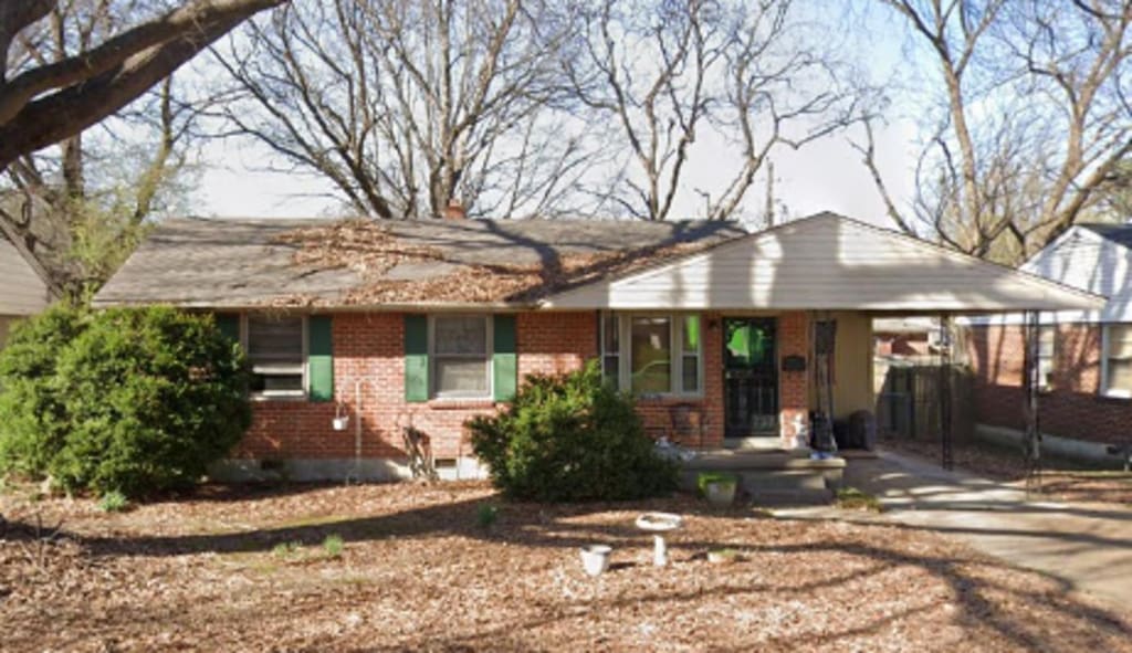 4924 Biscoe Rd, Memphis, TN 38122 - single story home featuring brick siding, an attached carport, and concrete driveway