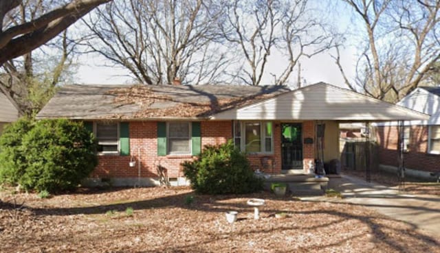 4924 Biscoe Rd, Memphis, TN 38122 - single story home featuring brick siding, an attached carport, and concrete driveway