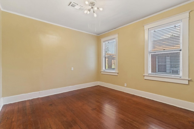 515 N Dunlap St, Memphis, TN 38105 - unfurnished room with a chandelier, dark wood-type flooring, and crown molding