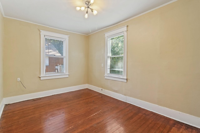 515 N Dunlap St, Memphis, TN 38105 - empty room featuring dark wood-type flooring, a chandelier, and ornamental molding