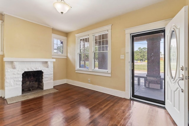 515 N Dunlap St, Memphis, TN 38105 - entryway with dark wood finished floors and a stone fireplace