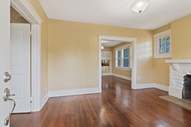 515 N Dunlap St, Memphis, TN 38105 - unfurnished living room featuring a stone fireplace and wood finished floors