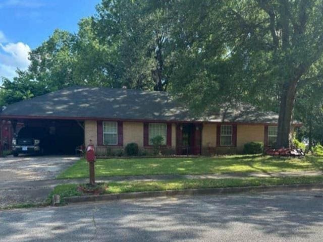 5509 Rappahannock Dr, Memphis, TN 38134 - ranch-style house with asphalt driveway, an attached carport, and a front yard