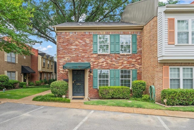 875 S Yates Rd Unit 4, Memphis, TN 38120 - view of front of house with uncovered parking and brick siding